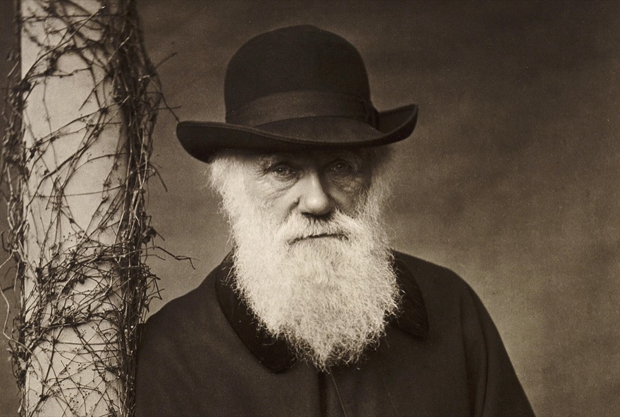 Charles Darwin in old age, with a long white beard and a broad-brimmed hat