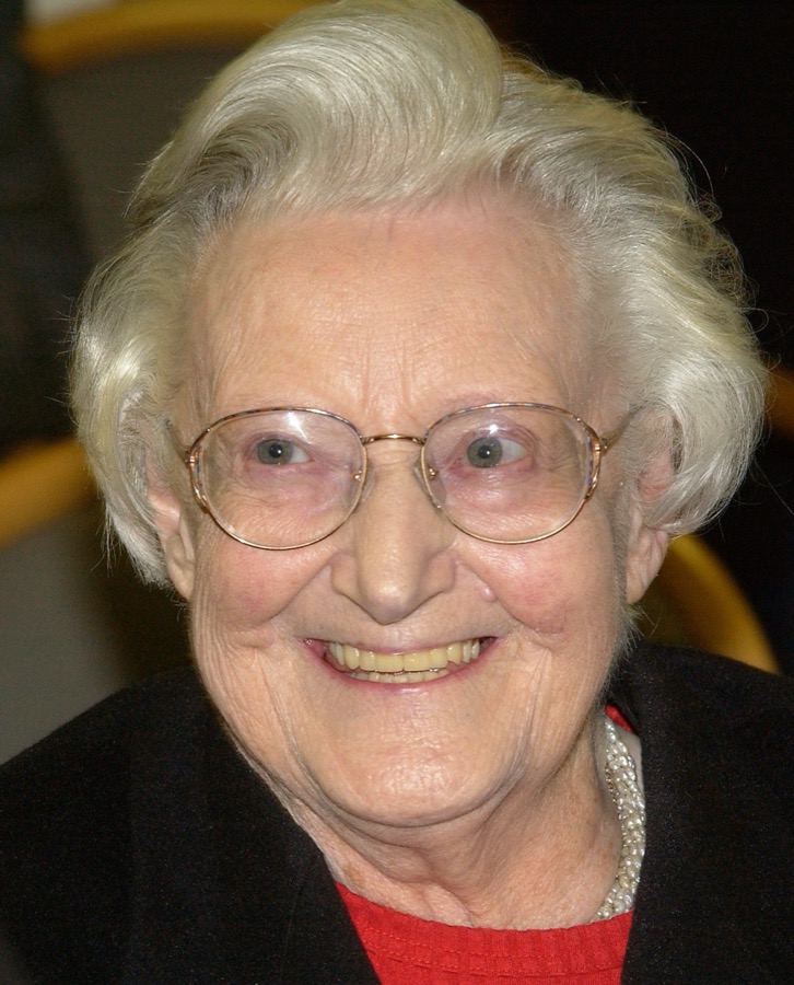 Cicely Saunders, smiling, in a cardigan and pearls